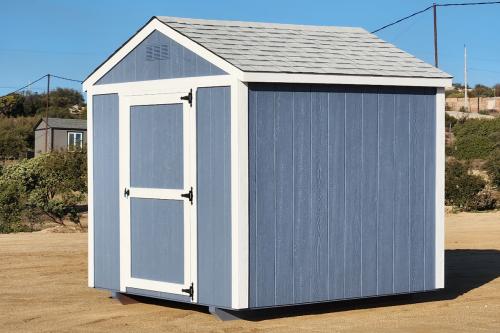 An 8 by 8 foot basic blue shed with white trim